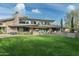 Modern home exterior with expansive lawn and landscaping at 9151 N Kober Rd, Paradise Valley, AZ 85253