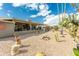 Landscaped backyard with desert plants and covered patio at 949 S 79Th Way, Mesa, AZ 85208