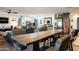 Open concept dining area with a live edge table and black barstools at 949 S 79Th Way, Mesa, AZ 85208