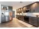 Modern kitchen with dark wood cabinets and granite countertops at 949 S 79Th Way, Mesa, AZ 85208