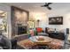 Living room with a modern fireplace and comfortable seating at 949 S 79Th Way, Mesa, AZ 85208