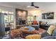 Living room with a modern fireplace and comfortable seating at 949 S 79Th Way, Mesa, AZ 85208