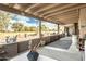 Covered patio with seating area and views of the backyard at 949 S 79Th Way, Mesa, AZ 85208