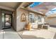 Covered patio with seating area, creating an inviting outdoor space at 949 S 79Th Way, Mesa, AZ 85208