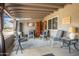 Relaxing covered patio with seating area and outdoor decor at 949 S 79Th Way, Mesa, AZ 85208