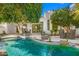Tranquil backyard oasis with a pool and outdoor seating area at 10041 N 52Nd Pl, Paradise Valley, AZ 85253