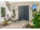 Stylish entryway with modern chairs, accent lighting, and attractive double doors at 10041 N 52Nd Pl, Paradise Valley, AZ 85253