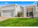 Charming home featuring a well-maintained lawn, driveway, and an attached two-car garage at 10041 N 52Nd Pl, Paradise Valley, AZ 85253