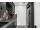 Laundry room boasts stylish cabinets, stone counters, and a stackable washer/dryer at 10041 N 52Nd Pl, Paradise Valley, AZ 85253