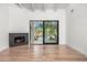 Light-filled living room with fireplace and sliding glass door to the yard at 10041 N 52Nd Pl, Paradise Valley, AZ 85253