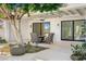 Covered patio with comfortable seating and a view of the backyard at 10041 N 52Nd Pl, Paradise Valley, AZ 85253