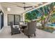 Covered patio with comfortable seating and a view of the backyard and pool at 10041 N 52Nd Pl, Paradise Valley, AZ 85253