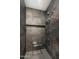 Sleek tiled shower with built-in shelf and seat, featuring a modern showerhead and hand-held sprayer at 10041 N 52Nd Pl, Paradise Valley, AZ 85253