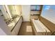 Bright bathroom with double sinks, a free-standing bathtub, and modern tile at 1010 E Pierson St, Phoenix, AZ 85014