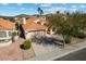 Single-story home with a tile roof and driveway, in a residential neighborhood at 10263 S Hopi Ln, Goodyear, AZ 85338