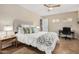 Bright bedroom with a queen-size bed, workspace, and tiled floor at 1300 Coyote Pass --, Carefree, AZ 85377