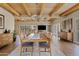 Large dining room with wood beam ceiling, chandelier, and long wooden table at 1300 Coyote Pass --, Carefree, AZ 85377