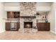 Stone fireplace flanked by custom cabinetry and wine storage at 1300 Coyote Pass --, Carefree, AZ 85377