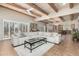 Open living area with wood beam ceiling, large sectional sofa and views to kitchen at 1300 Coyote Pass --, Carefree, AZ 85377