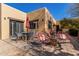 Outdoor patio with seating area and red umbrella at 1300 Coyote Pass --, Carefree, AZ 85377
