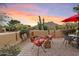 Outdoor patio with seating area, fire pit, and mountain views at 1300 Coyote Pass --, Carefree, AZ 85377