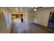 Open living area with kitchen, carpet, and sliding glass door at 1432 W Emerald Ave # 647, Mesa, AZ 85202