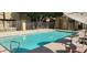 Community pool with surrounding patio furniture at 1432 W Emerald Ave # 647, Mesa, AZ 85202