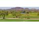 Community landscape with a lake and mountain views at 1713 W Morse Dr, Anthem, AZ 85086