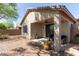 Covered patio with seating area and desert landscape at 1713 W Morse Dr, Anthem, AZ 85086