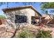 Covered patio with seating area, overlooking a desert landscape at 1713 W Morse Dr, Anthem, AZ 85086