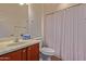 Clean bathroom with shower, toilet and wood vanity at 1713 W Morse Dr, Anthem, AZ 85086