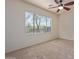 Spacious bedroom with ceiling fan and large window at 1713 W Morse Dr, Anthem, AZ 85086