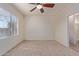 Bright bedroom featuring ceiling fan and plush carpeting at 1713 W Morse Dr, Anthem, AZ 85086