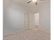 Spacious bedroom with double doors and carpet flooring at 1713 W Morse Dr, Anthem, AZ 85086
