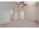 Well-lit bedroom with ceiling fan and ample closet space at 1713 W Morse Dr, Anthem, AZ 85086