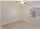 Bright bedroom with ceiling fan and window coverings at 1713 W Morse Dr, Anthem, AZ 85086