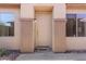 Front entry with neutral-colored door and a welcome mat at 1713 W Morse Dr, Anthem, AZ 85086