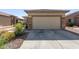Two-car garage with neutral-colored door and stone accents at 1713 W Morse Dr, Anthem, AZ 85086