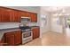 Bright kitchen featuring stainless steel appliances and tile flooring at 1713 W Morse Dr, Anthem, AZ 85086