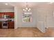 Eat-in kitchen with dark wood cabinets and stainless steel appliances at 1713 W Morse Dr, Anthem, AZ 85086