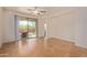 Living room with tile floors and access to backyard patio at 1713 W Morse Dr, Anthem, AZ 85086