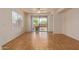 Living room with tile floor and sliding glass door to patio at 1713 W Morse Dr, Anthem, AZ 85086
