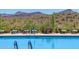 Relaxing pool area with scenic mountain backdrop at 1713 W Morse Dr, Anthem, AZ 85086