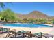 Expansive pool with comfortable lounge chairs at 1713 W Morse Dr, Anthem, AZ 85086