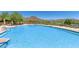 Large community pool with plenty of lounge chairs at 1713 W Morse Dr, Anthem, AZ 85086