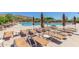 Relaxing pool deck with lounge chairs and umbrellas at 1713 W Morse Dr, Anthem, AZ 85086