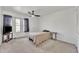 Bedroom featuring neutral walls, carpet, a single bed, side table, television stand, and closet at 2533 W Hazelwood St # 3, Phoenix, AZ 85017
