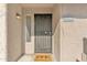 Close up of front door with security gate, welcome mat, and unit number for added security at 2533 W Hazelwood St # 3, Phoenix, AZ 85017