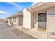 Inviting front exterior with neutral stucco, covered entry, and low maintenance rock landscaping at 2533 W Hazelwood St # 3, Phoenix, AZ 85017