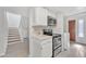 Efficient kitchen with stainless steel oven/microwave combination and convenient access to living areas at 2533 W Hazelwood St # 3, Phoenix, AZ 85017